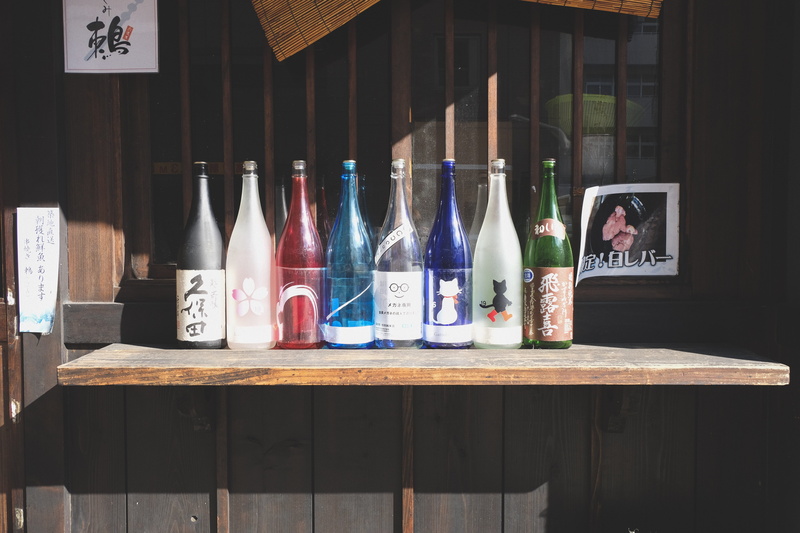text, retail display, arrangement, wood - material, retail, still life, day, bottle, 5K, roppongi, glass - material, japan, transparent, indoors, large group of objects