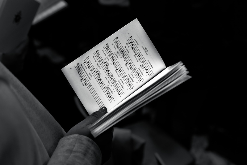 close-up, real people, body part, audio, non-western script, ticket, photography, hand, human hand, human body part, text, script, religion, indoors, singing