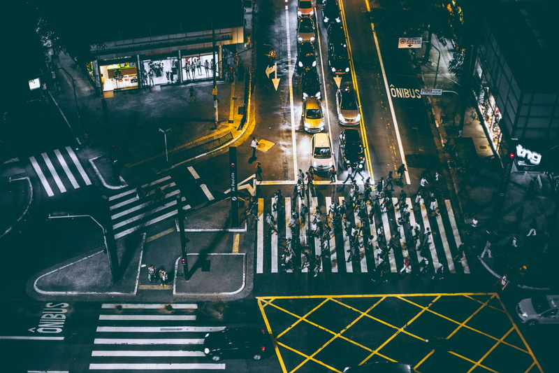 illuminated, city, building exterior, architecture, crosswalk, high angle view, connection, night, built structure, angle, street, lights, mode of transportation