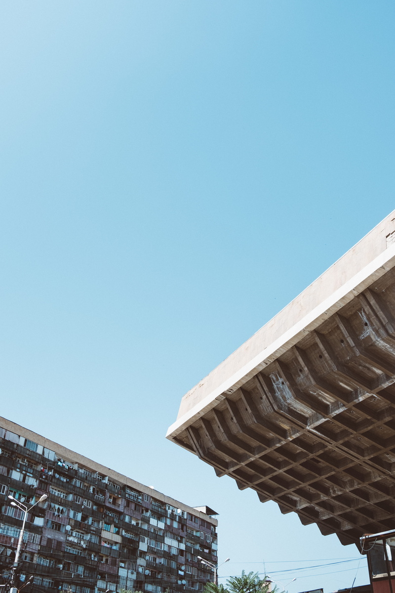 concrete, history, day, building exterior, low angle view, travel destinations, outdoors, yerevan, sunlight, the past, copy space, no people, built structure