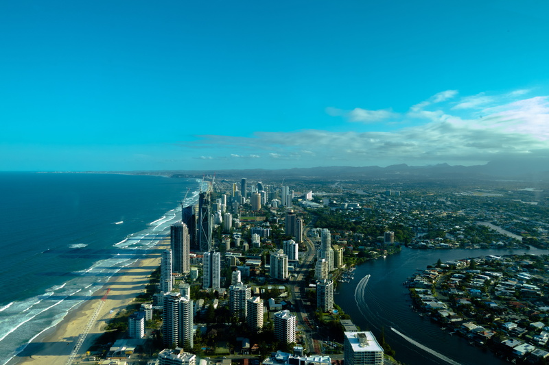 office building exterior, cityscape, aerial view, built structure, outdoors, blue, sky, surfers paradise, high angle view, modern, skypoint observation deck