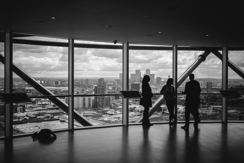 silhouette, adult, modern, buildings, architecture, windows, observation deck, city, sky, cloud - sky, black and white, flooring, panorama, skyline, glass - material