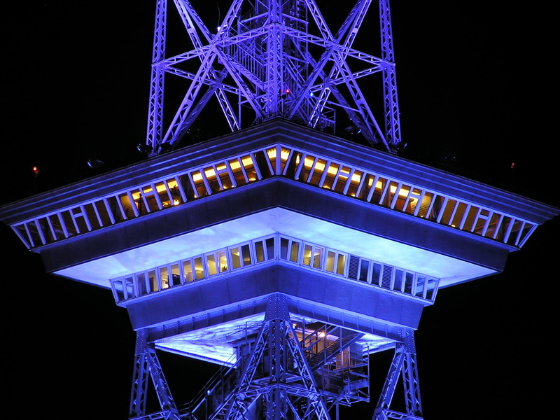 lighting equipment, travel destinations, observation deck, city, sky, architecture, tower, outdoors, radio tower, blue, built structure, building exterior