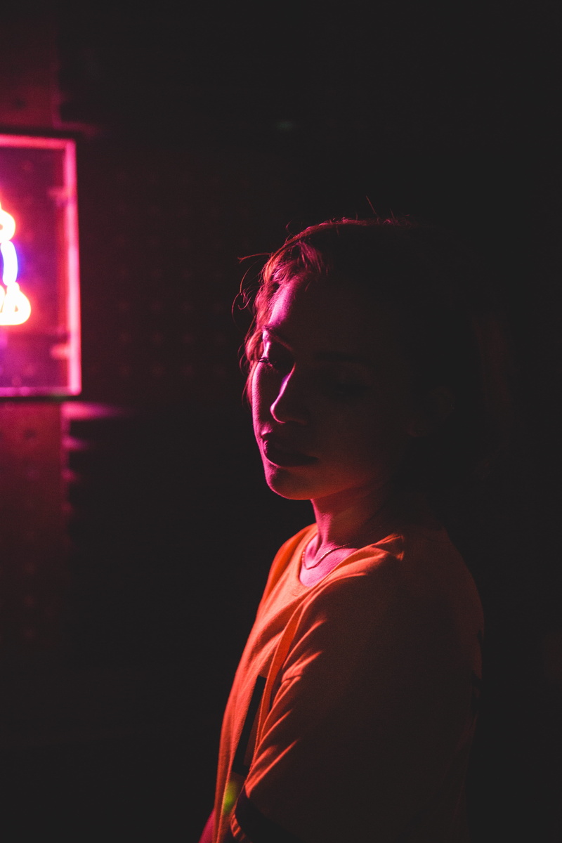 black background, illuminated, women, contemplation, studio shot, teenager, side view, hipster, young women, urban, lifestyles, red, lighting equipment