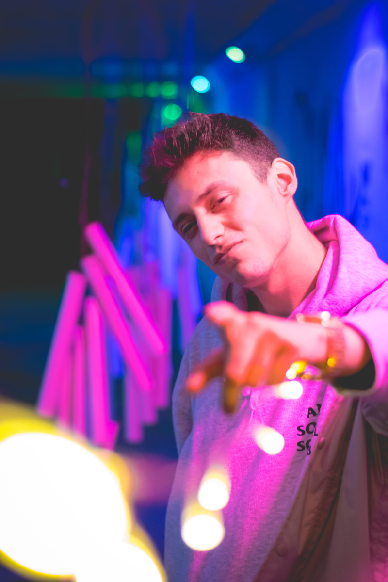 lights, saturation, looking, one person, urban, neon, purple, colorful, real people, red, indoors, lighting equipment, leisure activity, focus on foreground