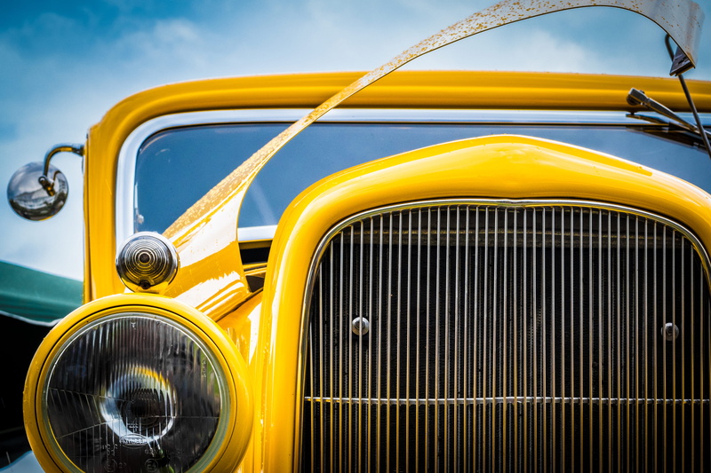 motor vehicle, photo, closeup, lighting equipment, transportation, mode of transportation, custom car, photography, vehicle, antique, focus on foreground