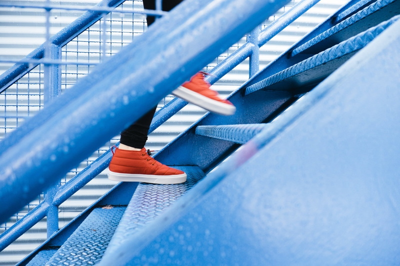 cleaning, pair, day, security, red, blurred motion, close-up, barrier, metal, railing, shoes, transportation, protection, no people, sneakers, blue, motion