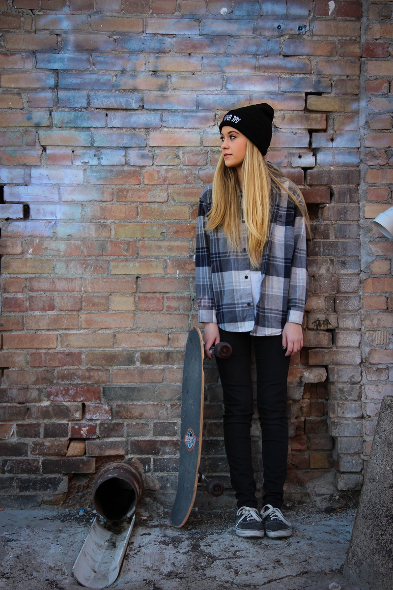 beanie weather, teenager, brick, skate, hairstyle, brick wall, skater girl, girl, front view, one person, lifestyles, young adult, leisure activity, built structure