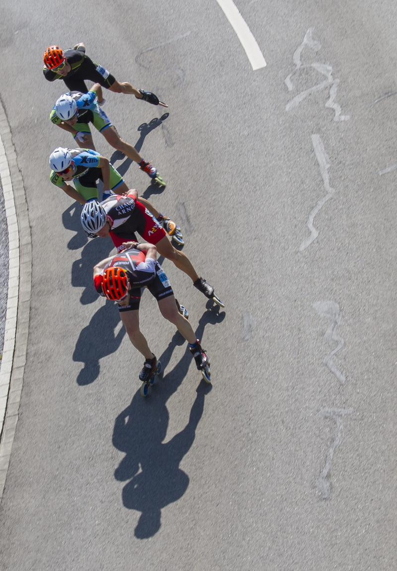 shadow, sport, recreational sports, city, leisure activity, motion, road, men, inline race, street, people, inliner, day, group of people, inline skating