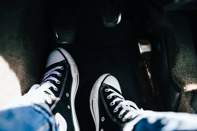 lifestyles, unrecognizable person, land vehicle, human Foot, men, car, jeans, human body part, casual, winter, canvas shoe, black, car interior, mode of transportation