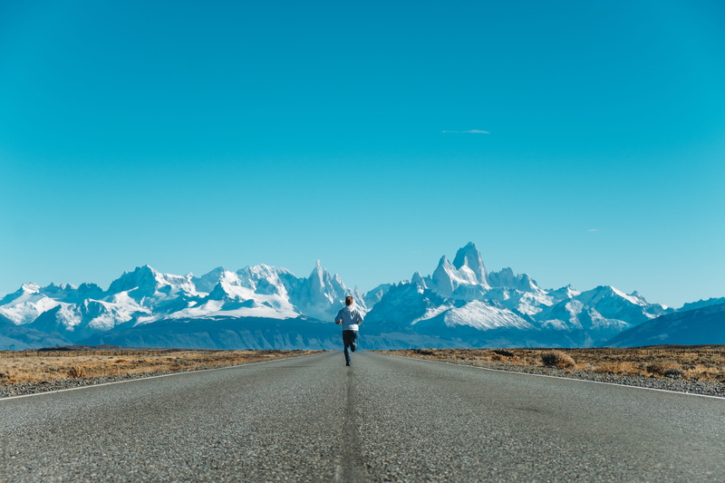 ice, patagonia, beauty in nature, landscape, way, environment, one person, road, scenics - nature, non-urban scene, dirt road, asphalt, running, mountain