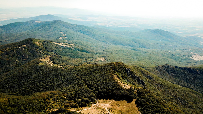 fog, daylight, mountain range, green color, aerial shot, valley, land, rolling landscape, 4K, no people, drone shot, non-urban scene, drone footage, travel destinations