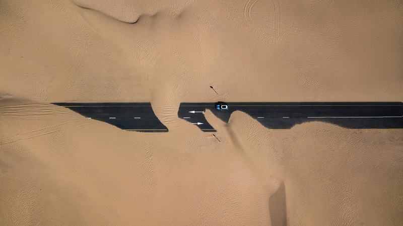 cleaning, sand, no people, wall - building feature, full frame, drone footage, lifestyles, drone shot, Mini Cooper, metal, birds eye view, dusty road, desert