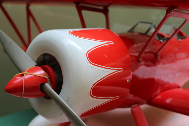 airplane, work tool, no people, outdoors, pale, day, close-up, red, hobbies, transportation, land vehicle, mode of transportation, 5K, propeller, instead of piloting