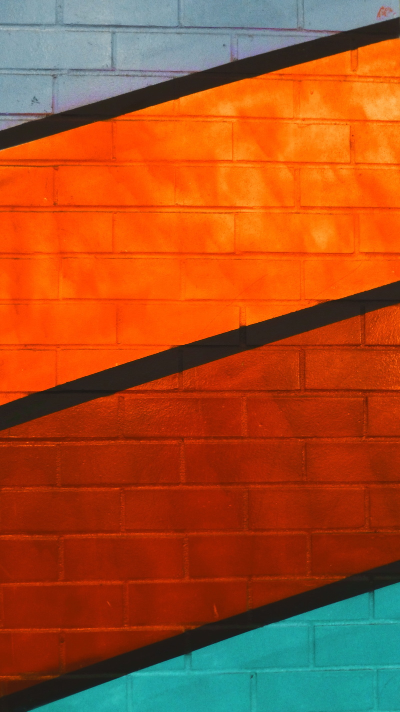 flooring, brick wall, orange, outdoors, texture, backgrounds, no people, built structure, wall - building feature, shadow, black, brick, absence, sunlight