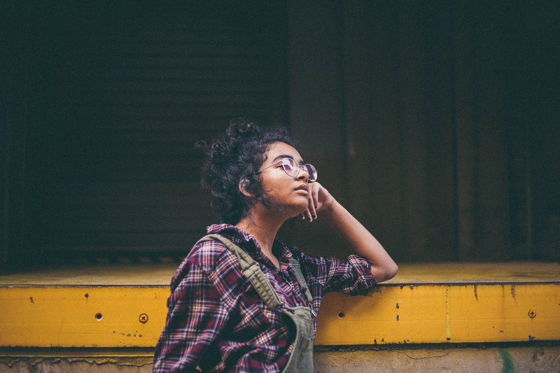 female, dungarees, 5K, yellow, one person, beautiful woman, young adult, girl, waist up, glasses, looking away, looking, looking up, real people, checked pattern