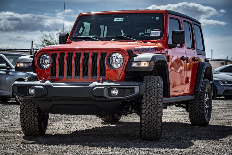 photo, parking lot, wrangler, vehicle, SUV, jeep, day, retro styled, automotive, shadow, car, sunlight, land vehicle, front view, sky, red, mode of transportation
