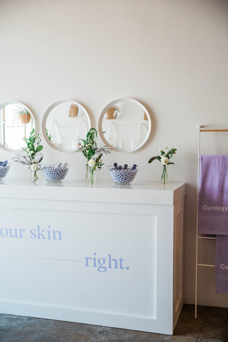 wall, flowering plant, indoors, curology, flower, furniture, box, corner, home decor, shelf, side, wooden, text, plant, pantry, cupboard, purple, table