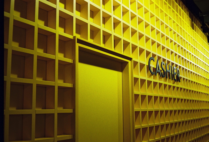 pattern, yellow, office building, banister, closet, outdoors, library, day, office building exterior, architecture, lighting, modern, word, indoors, no people