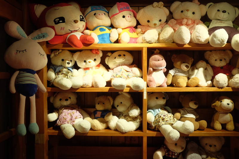 plywood, museum, store, retail display, teddy bear, large group of objects, bread, plush, choice, still life, abundance, doll, collection, retail, stuffed toy