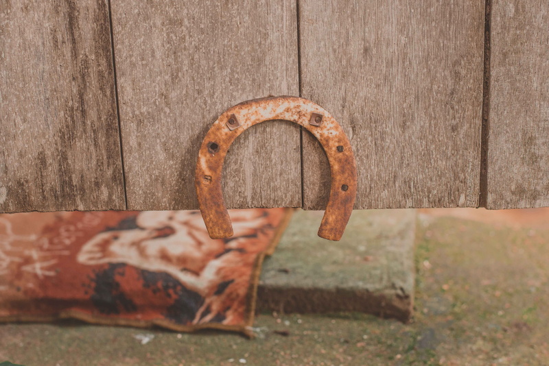 old, handle, outdoors, coat rack, no people, wood - material, day, wall - building feature, lock, single object, hoop, protection, rust, handwriting, flower