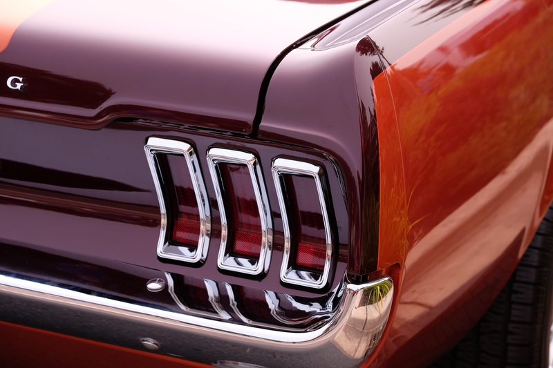 logo, emblem, train, land vehicle, machine, metal, trademark, symbol, window, vehicle light, car, retro styled, stationary, wealth, wheel, shiny, tire