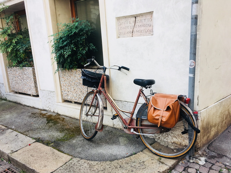 contrà pozzetto, walkway, wall, daytime, 4K, bag, leather, building exterior, day, parked, vicenza, architecture, mode of transportation, wall - building feature