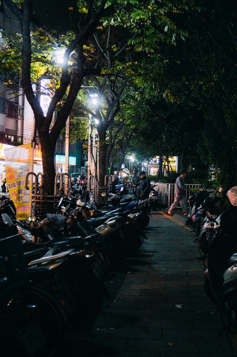 city, building exterior, motor scooter, vespa, person, wheel, nature, real people, bike, motorcycle, transportation, group of people, machine, moped, car