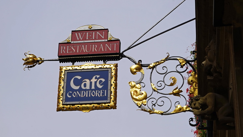 shield, sky, weinstube, day, text, samurai, food and drink, building exterior, illuminated, signage, built structure, cafe, low angle view, architecture