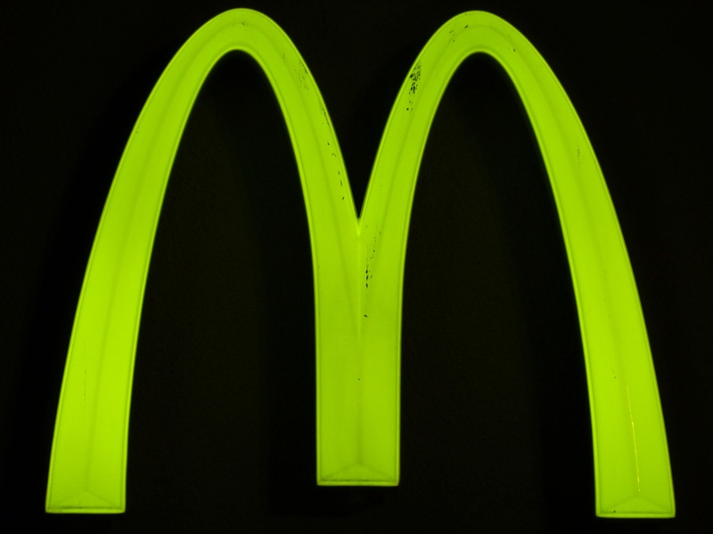 lettering, black color, night, yellow, no people, trademarks, close-up, shield, indoors, positive emotion, green, black background, advertising, emotion