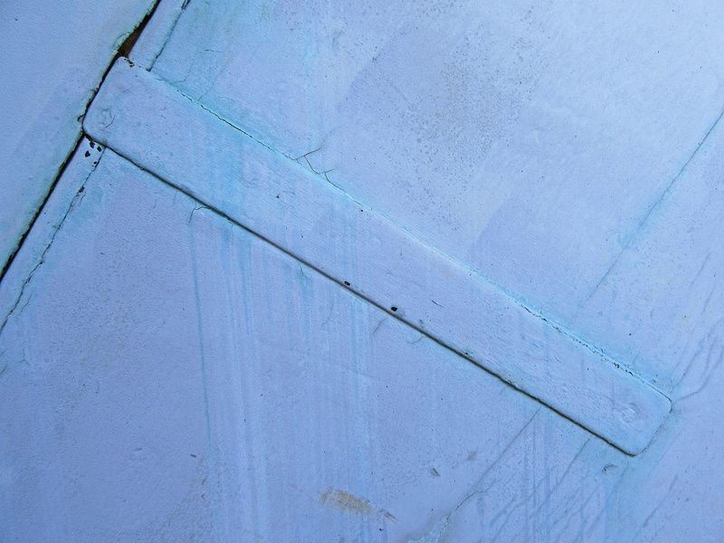 built structure, door, wood, concrete, close-up, handrail, furniture, weathered, suit, blue, banister, pants, wall, white color, rough, textured, overcoat