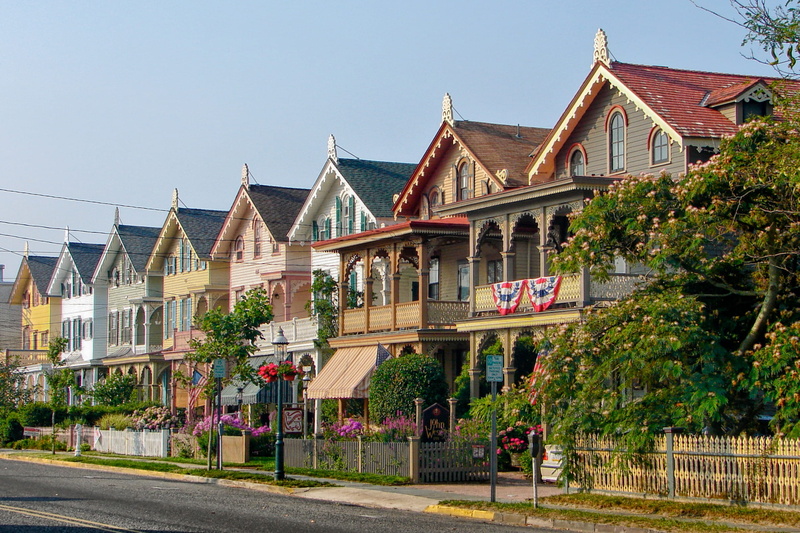 no people, flowering plant, town, houses, street, city, home ownership, wooden, plant, nature, building, flower, tree, residential district, clouds, multi colored