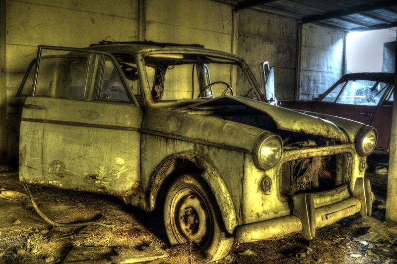 trailer, obsolete, deterioration, transportation, metal, junkyard, no people, land vehicle, indoors, damaged, black, motor vehicle, car, brown, old, mode of transportation