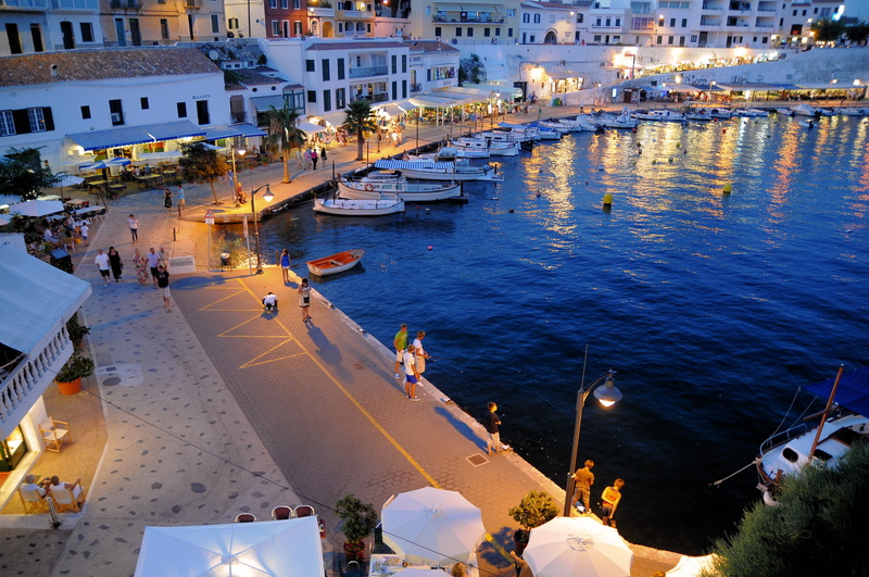 building exterior, built structure, mediterranean Sea, nighttime, night, real people, group of people, mode of transportation, large group of people, city