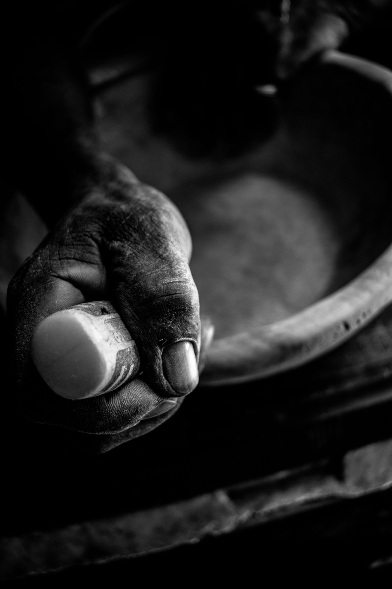 dirty, person, focus on foreground, lifestyles, hand, indoors, one person, men, goblet, dirt, human, finger, rasta, real people, pollution, tarmac, human finger