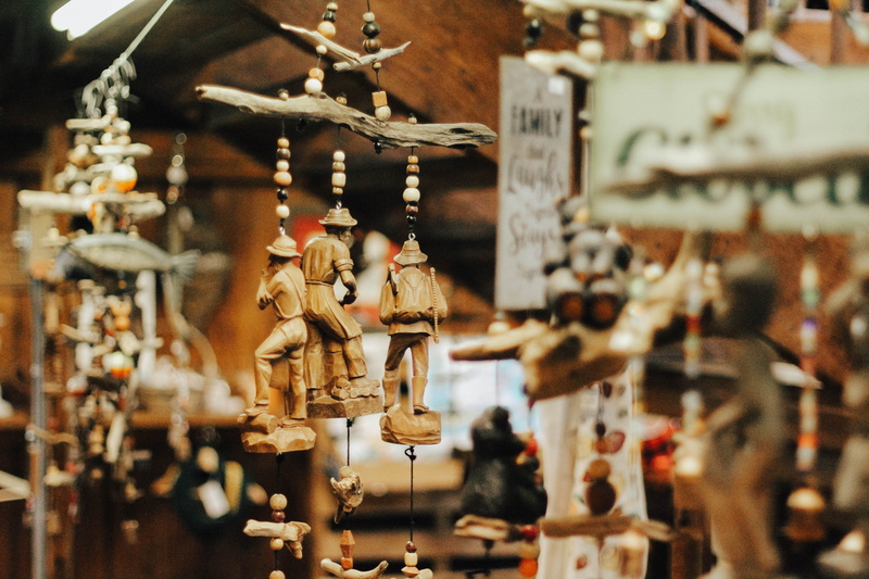 retail display, hanging, decoration, chime, choice, bird feeder, worship, focus on foreground, representation, toy, crucifix, for sale, bead, retail, selective focus