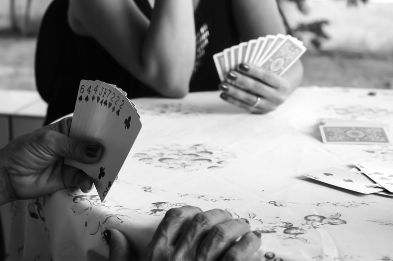 table, grayscale, one person, poker, real people, relaxation, women, play, Game, playing, adult, arts culture and entertainment, human hand, hand, Playing Cards