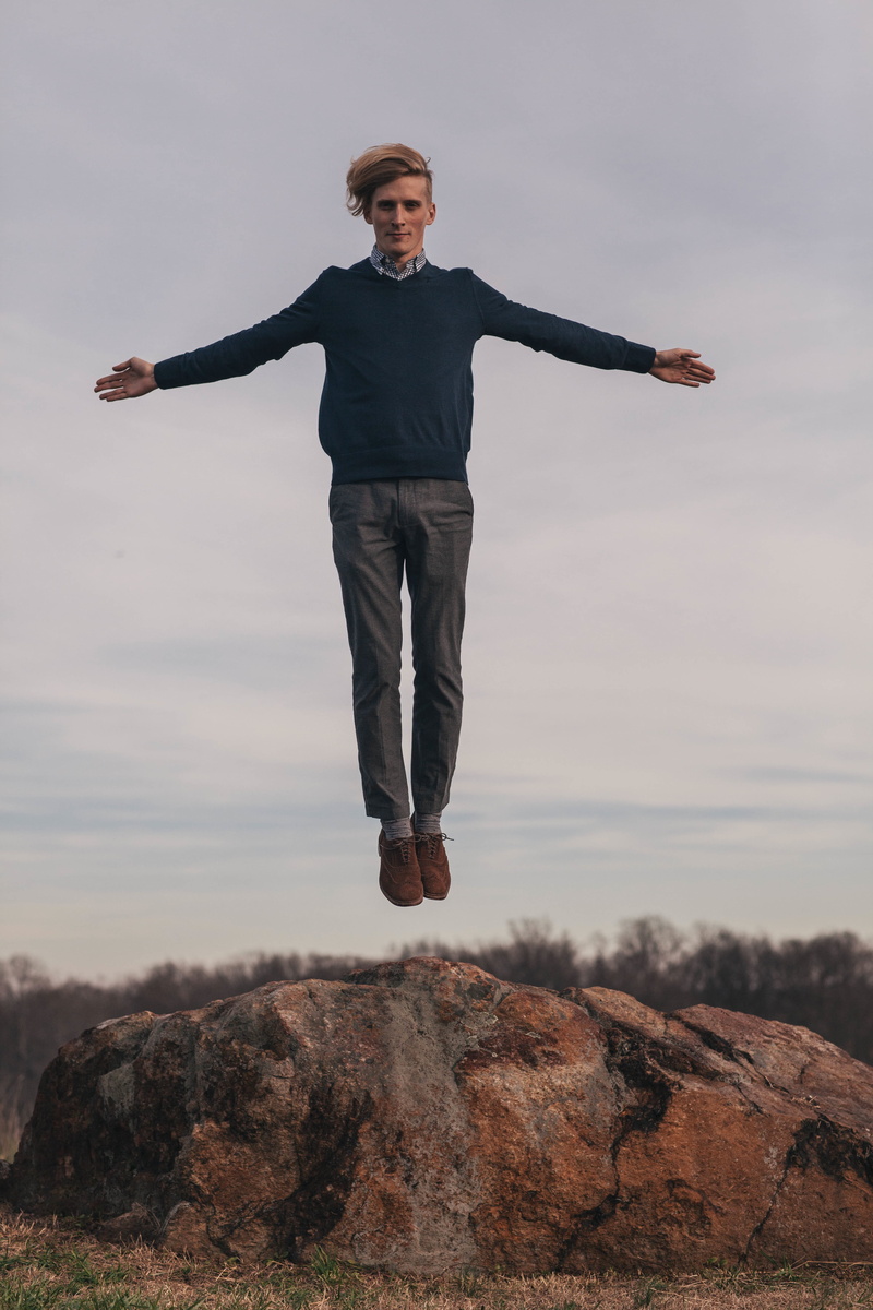 shot, caucasian Ethnicity, arms outstretched, adult, gray, rock - object, freedom, nature, man, action, young Adult, shirt, portrait, men, solid, excitement