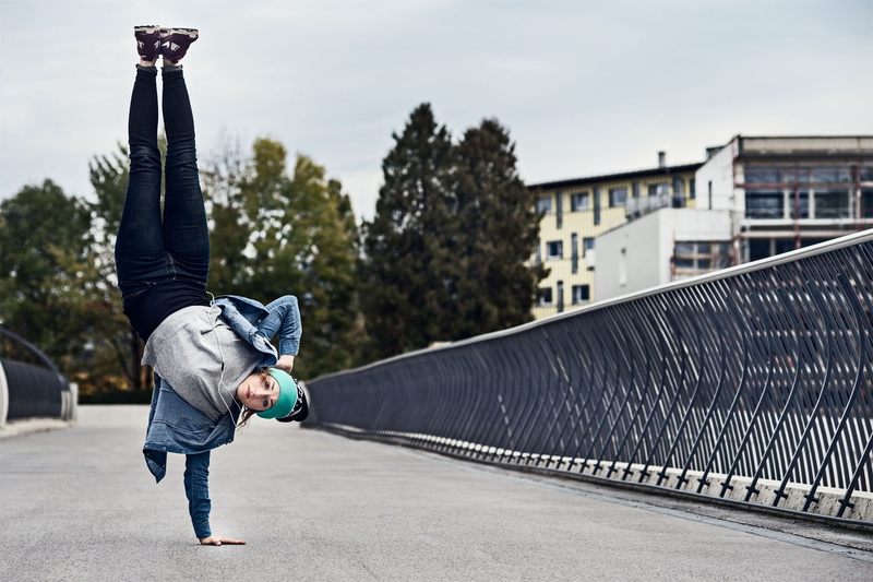 breakdance, gray, street, skill, real people, pants, s, motion, upside down, full length, hood - clothing, architecture, outdoors, city, dancer, men, rear view