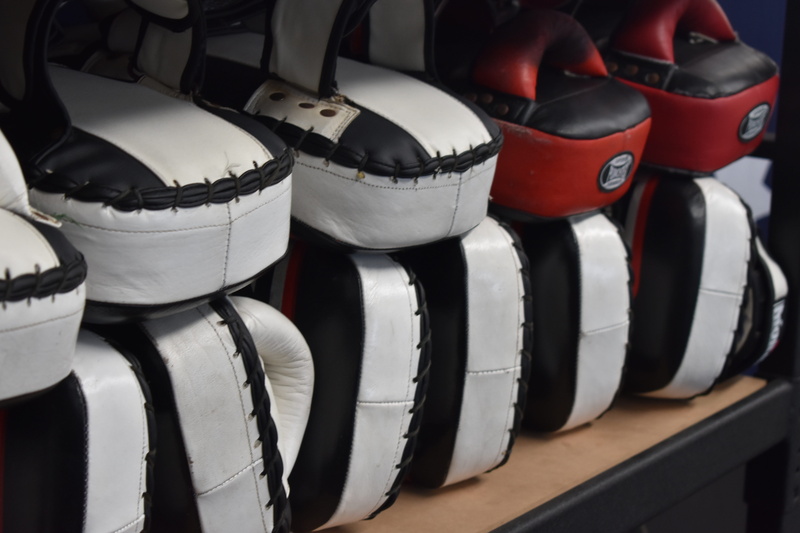indoors, helmet, competition, strength, group of objects, black color, equipment, gloves, punch, order, activity, sports equipment, conflict, fighting