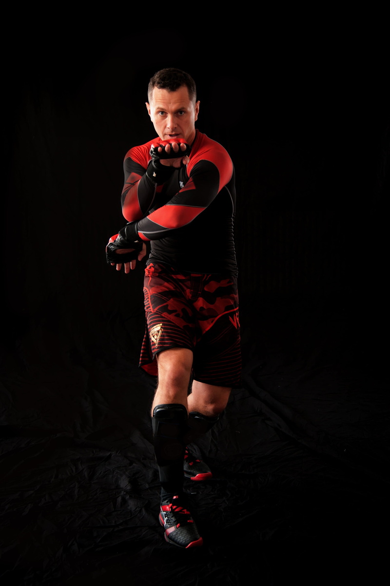 fight, athlete, healthy lifestyle, chi sao, standing, box, wing tzun, black background, sport, finger stitch, kung fu, strength, self-defense, studio shot