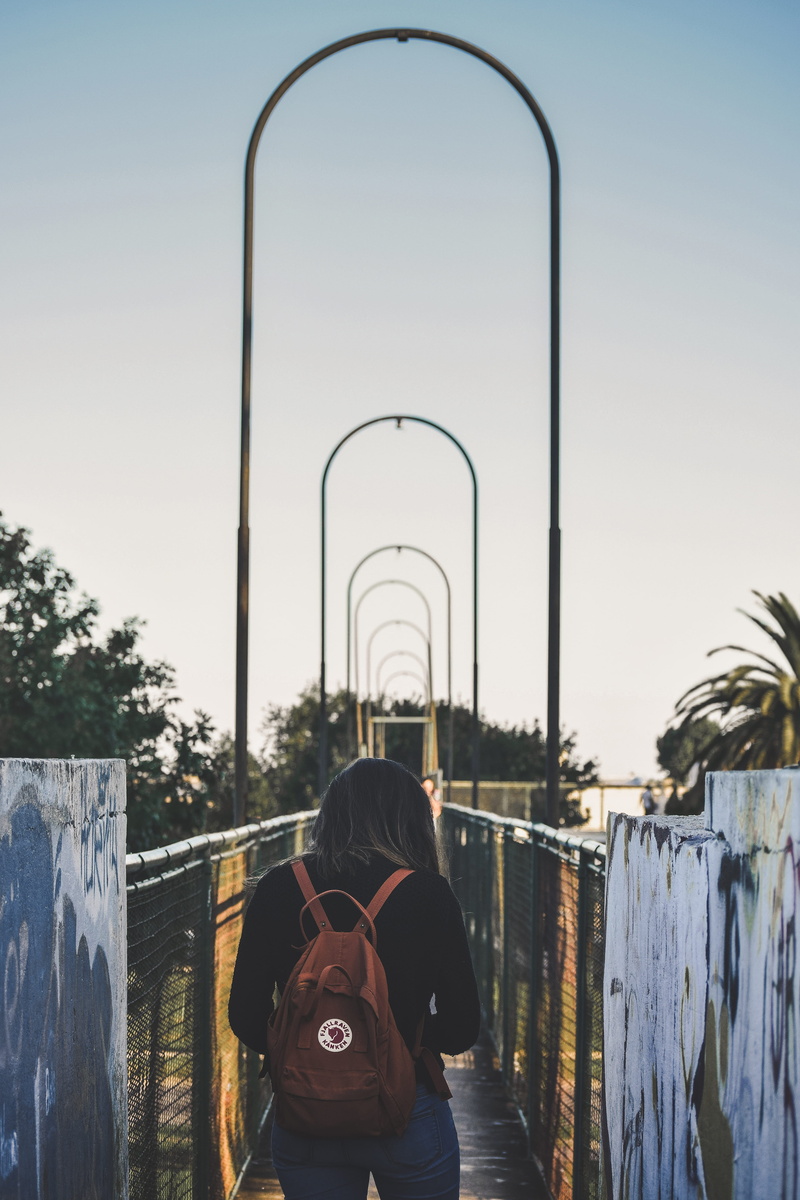 shorts, sky, lifestyles, argentina, street, near, girl, perspective, banister, day, real people, clear sky, woman, bridge, people, human, holding, built structure