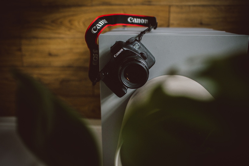 alloy wheel, black, photographic equipment, camera, leisure activity, retro styled, camera lens, lenses, white, strap, gearshift, screen, activity, selective focus