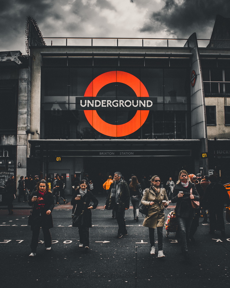 women, group of people, building, hustle, day, real people, architecture, brixton, large group of people, standing, men, outdoors, text, lifestyles, crowd