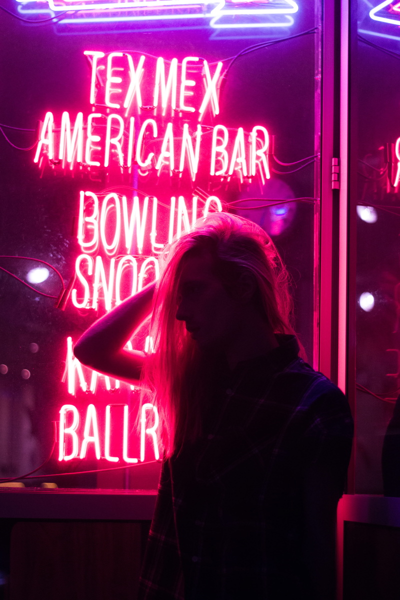 indoors, city, women, woman, near, commerce, western script, adult, hands, girl, silhoutte, night, light, architecture, sign, light - natural phenomenon
