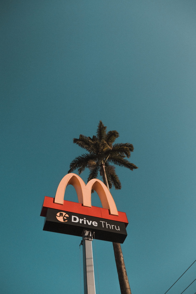 vertical, text, mcdonalds, architecture, outdoors, road, symbol, tropical climate, scenic, low angle view, day, no people, nature, bright, sky, palm tree