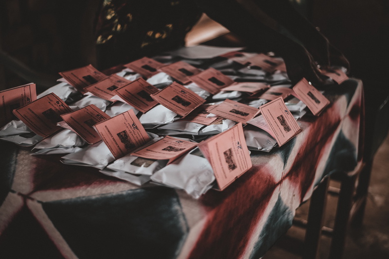 bedroom, wealth, advertisement, finance, origami, label, invitation, text, seat, currency, red, selective focus, savings, human, no people, wood - material