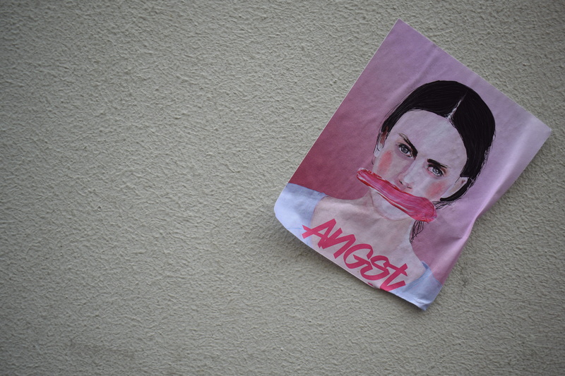 communication, tissue, canvas, portrait, origami, human representation, person, built structure, looking at camera, plastic bag, text, architecture, front view