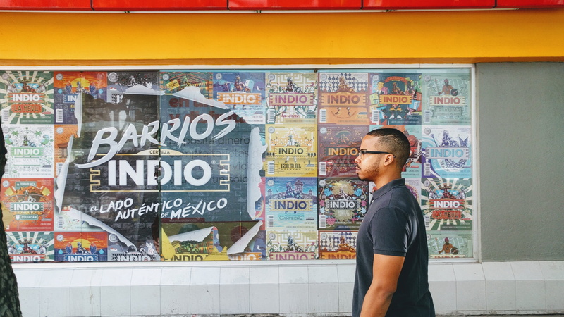 flyer, looking, man, mexico, african american, person, shirt, real people, casual clothing, human, ad, line, standing, creativity, one person, wall - building feature