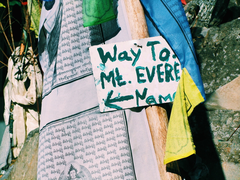 focus on foreground, poster, religion, day, script, close-up, handwriting, signage, crowd, paper, hanging, western script, vessel, non-western script, machine